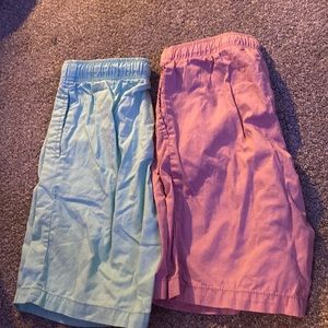 These are 2 Casual wear tween boys shorts 1 is pink  and 1 is mint green